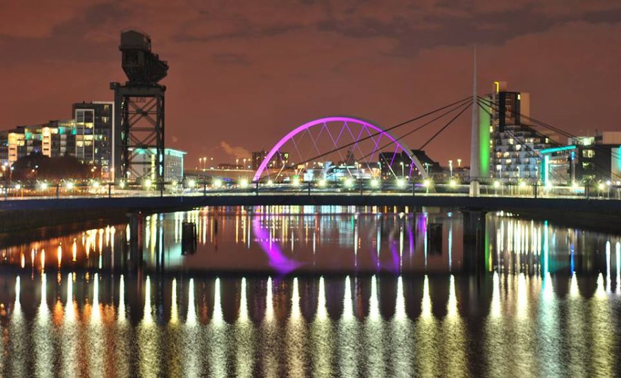 Clyde Arc Bridge illuminated at night in Glasgow, Scotland