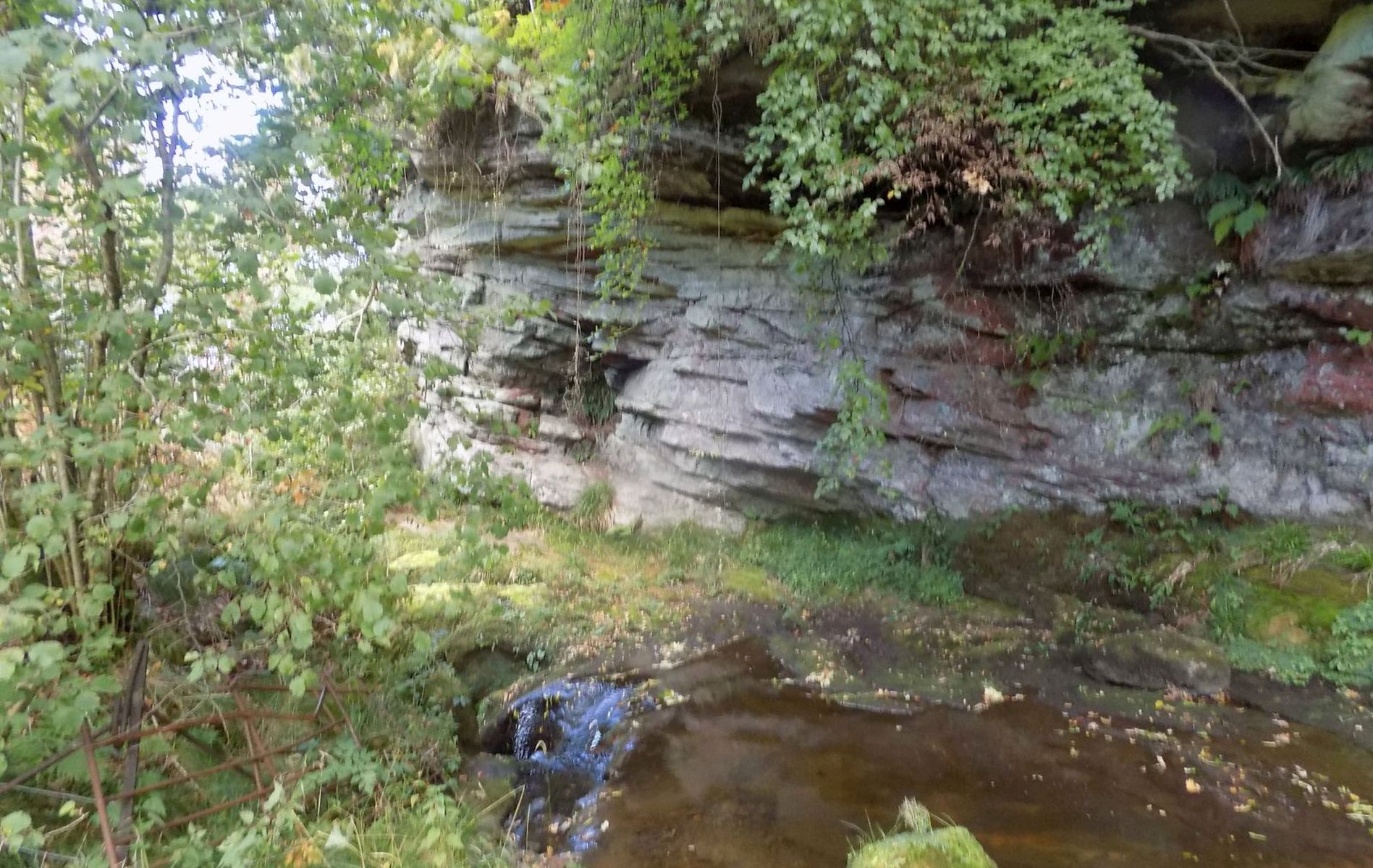 Rock face and waterfall above the Hole of Neith